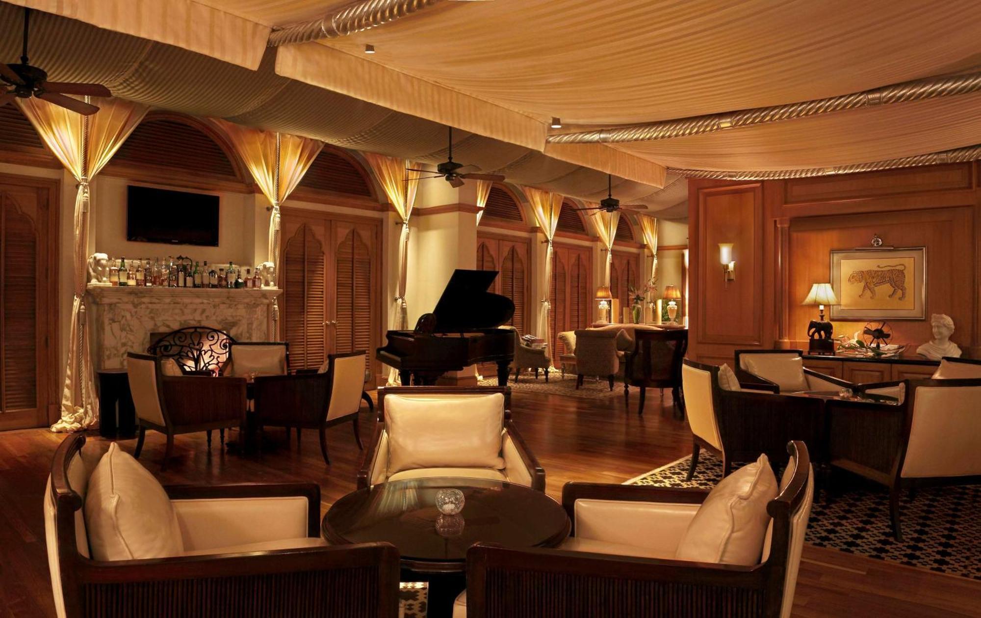 Hilton Mumbai International Airport Hotel Exterior photo The piano bar at the Taj Mahal Palace